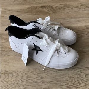 White sneakers with black star